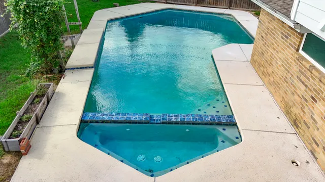 a view of swimming pool from a balcony
