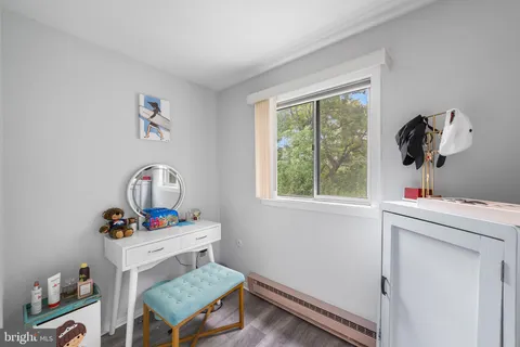 a view of balcony with wooden floor and outdoor seating