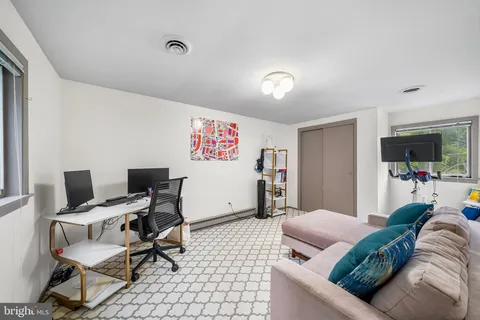 a living room with furniture and a rug