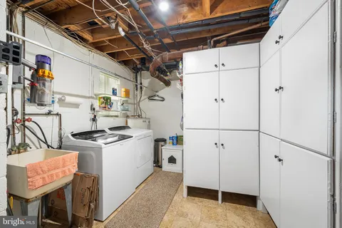 a view of a deck with furniture and garden