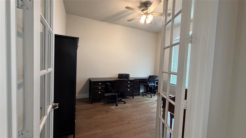 912 Fallbrook Avenue Denton, TX 76210 - Photo 14 of 26 a view of a workspace with furniture and a window