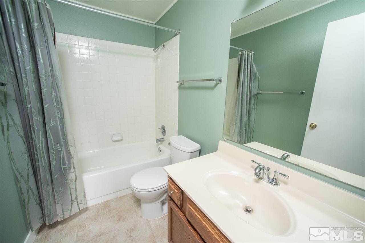 2730 Powder Drive Reno, NV 89503 - Photo 12 of 30 a bathroom with a sink a toilet and shower