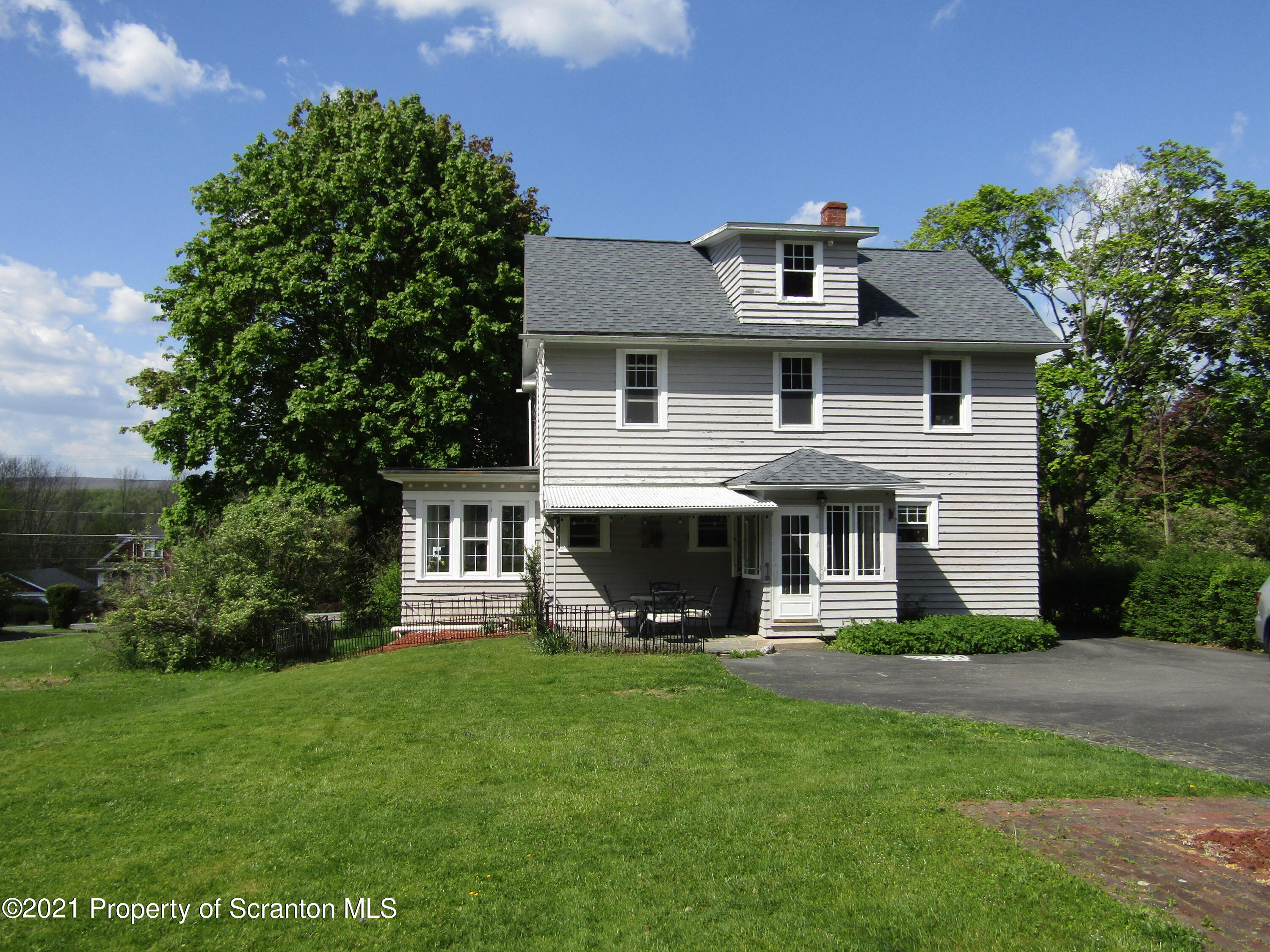 1314 State Rte 435 Moscow, PA 18444 - Photo 1 of 27 a front view of a house with a yard