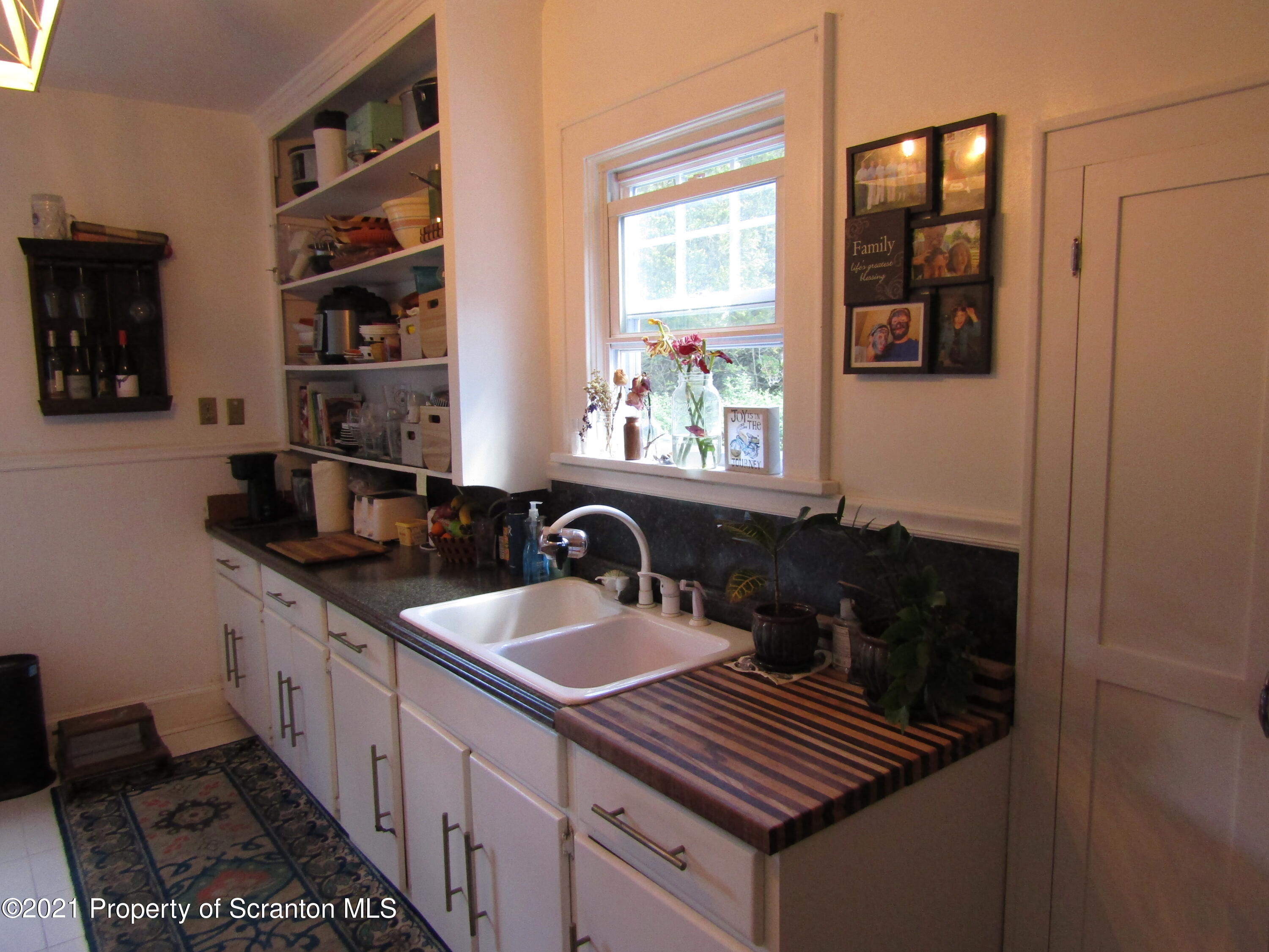 1314 State Rte 435 Moscow, PA 18444 - Photo 11 of 27 a kitchen with a sink and a stove next to a window
