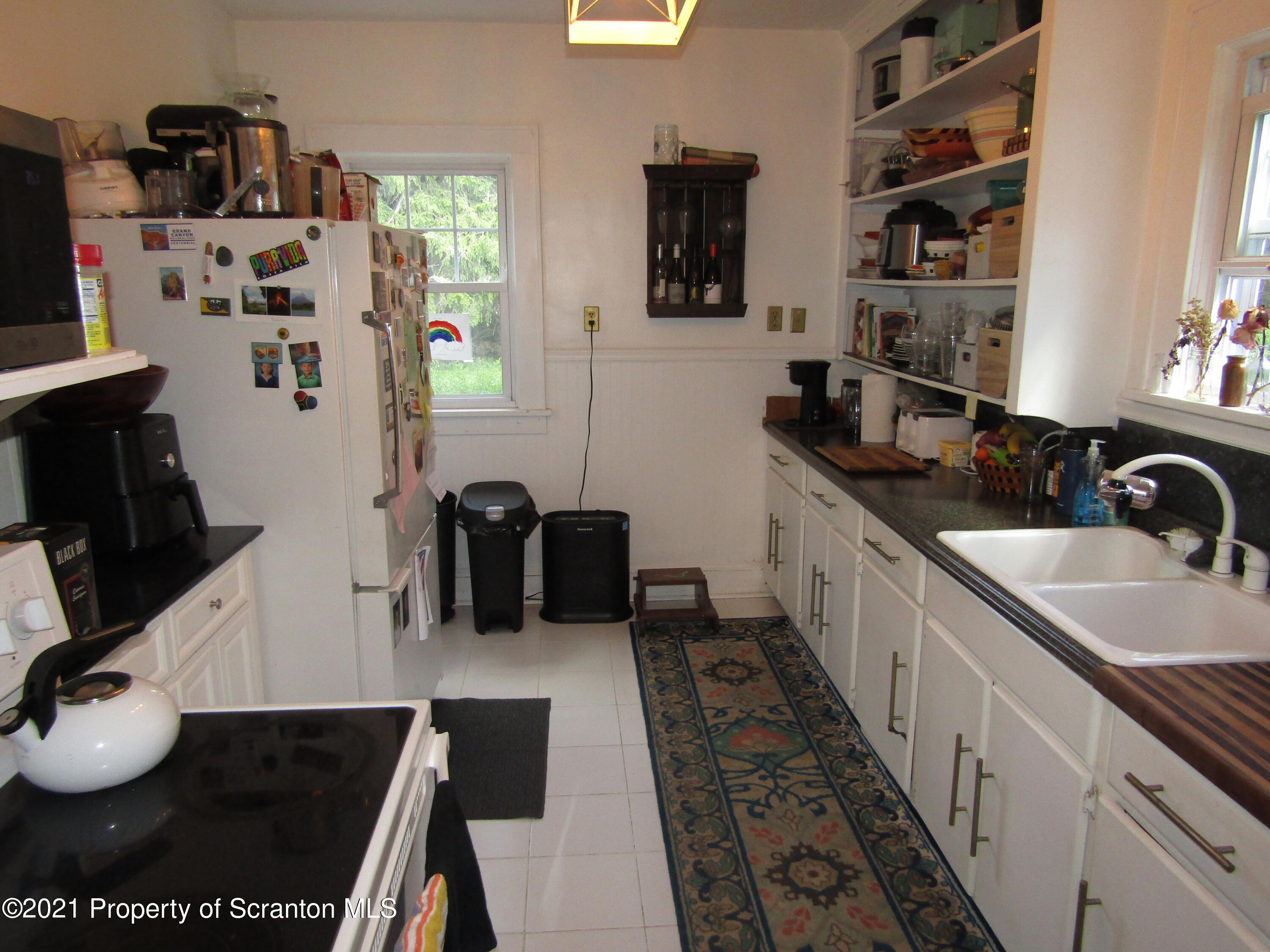 1314 State Rte 435 Moscow, PA 18444 - Photo 12 of 27 a kitchen with stainless steel appliances a sink and a stove