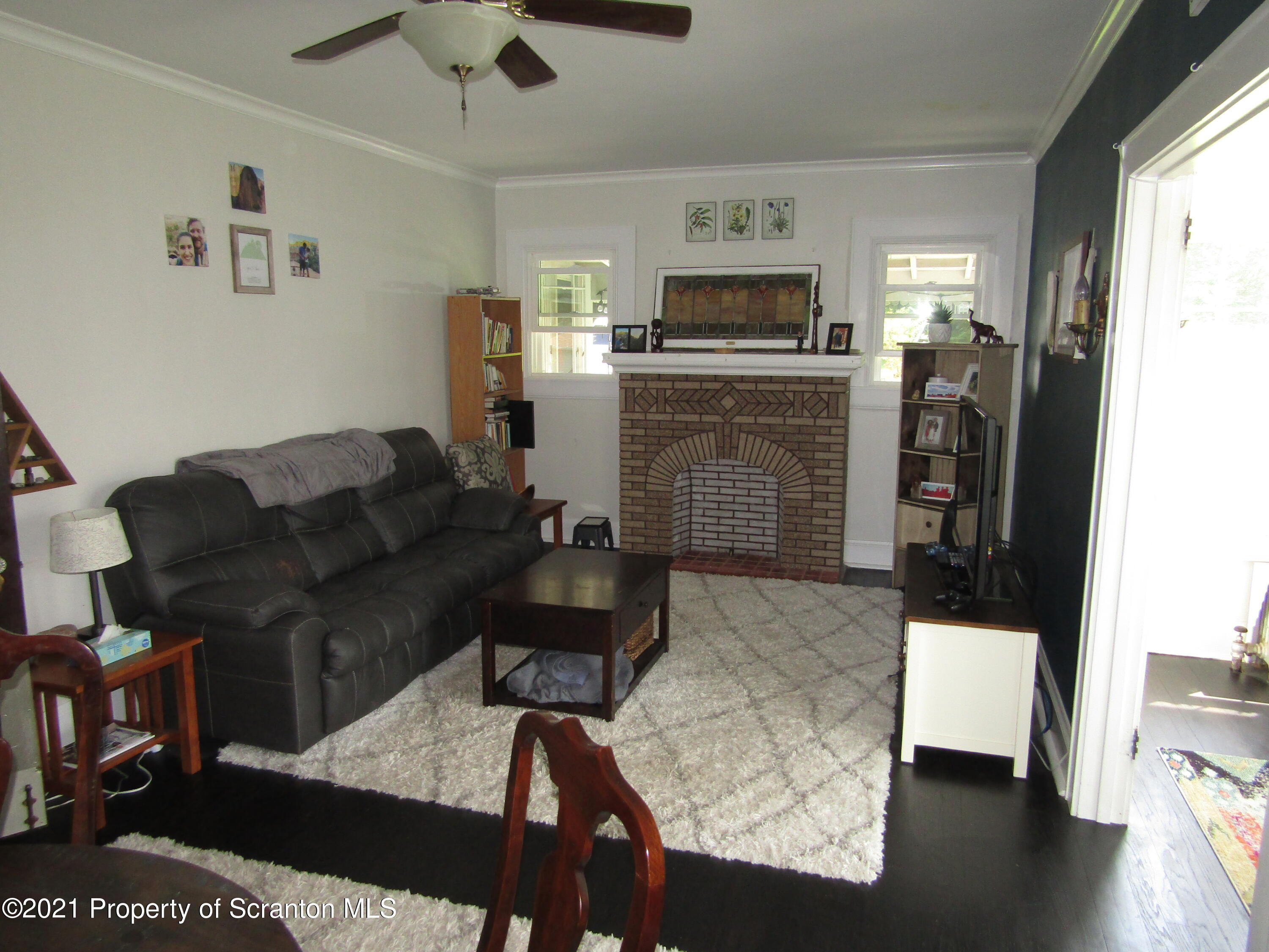 1314 State Rte 435 Moscow, PA 18444 - Photo 13 of 27 a living room with furniture and a flat screen tv