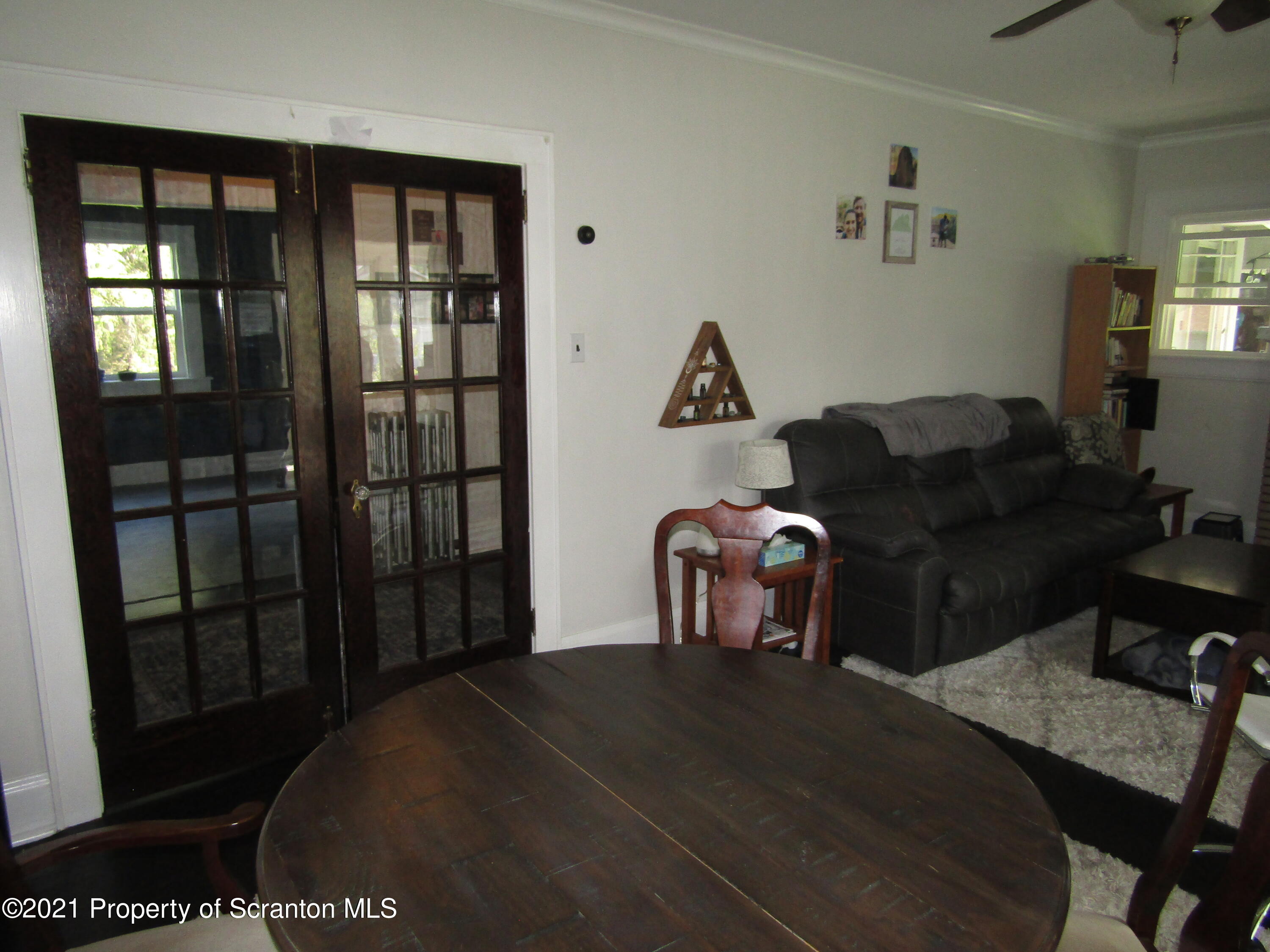 1314 State Rte 435 Moscow, PA 18444 - Photo 15 of 27 a bedroom with a bed and wooden floor
