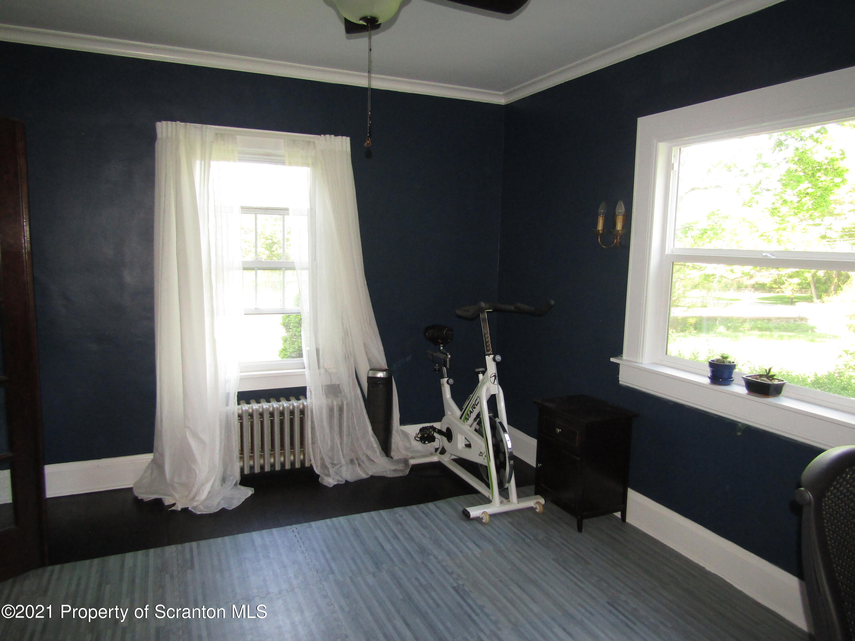 1314 State Rte 435 Moscow, PA 18444 - Photo 18 of 27 a view of a room with wooden floor and windows