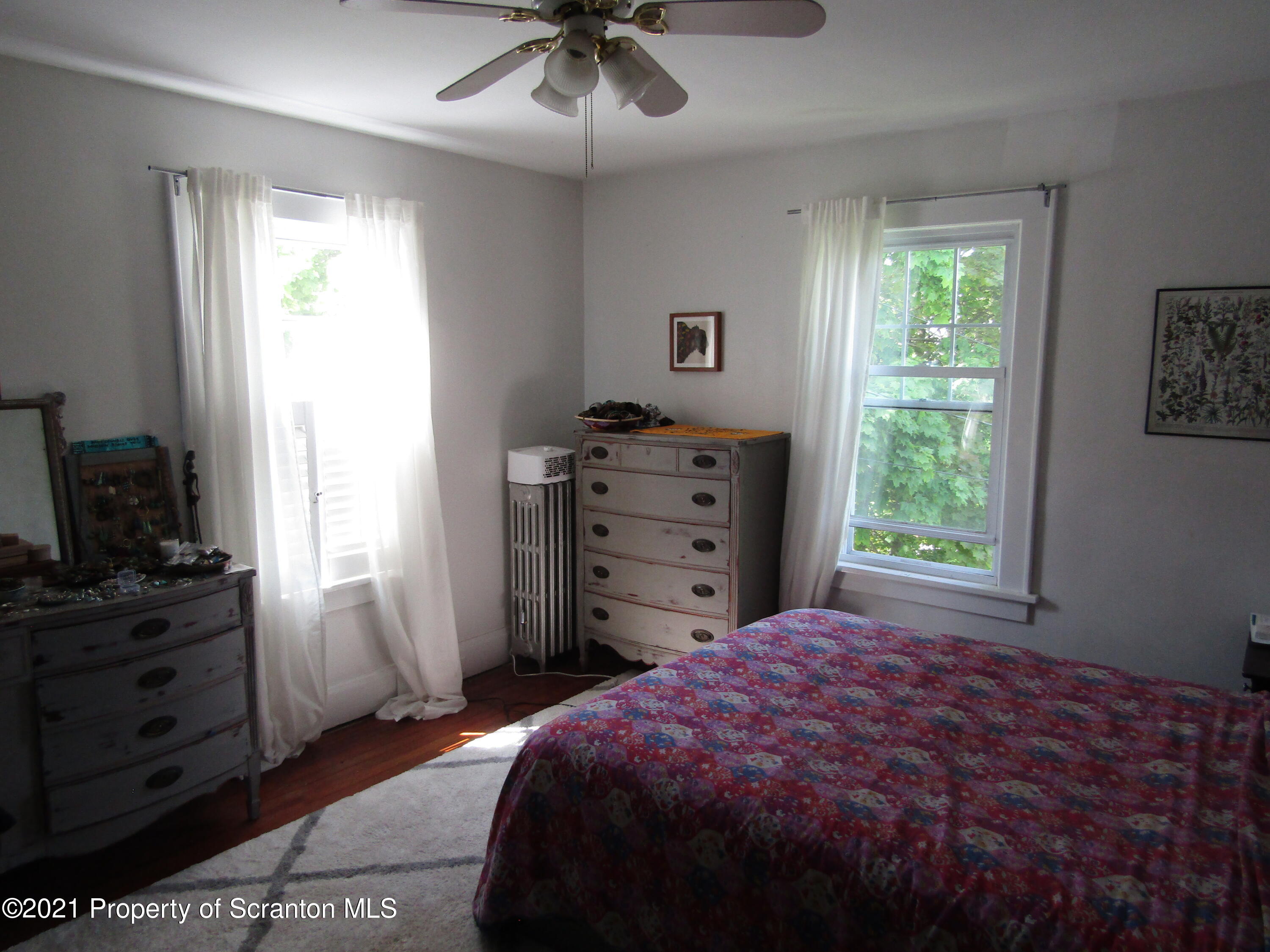 1314 State Rte 435 Moscow, PA 18444 - Photo 24 of 27 a bedroom with a bed and a window