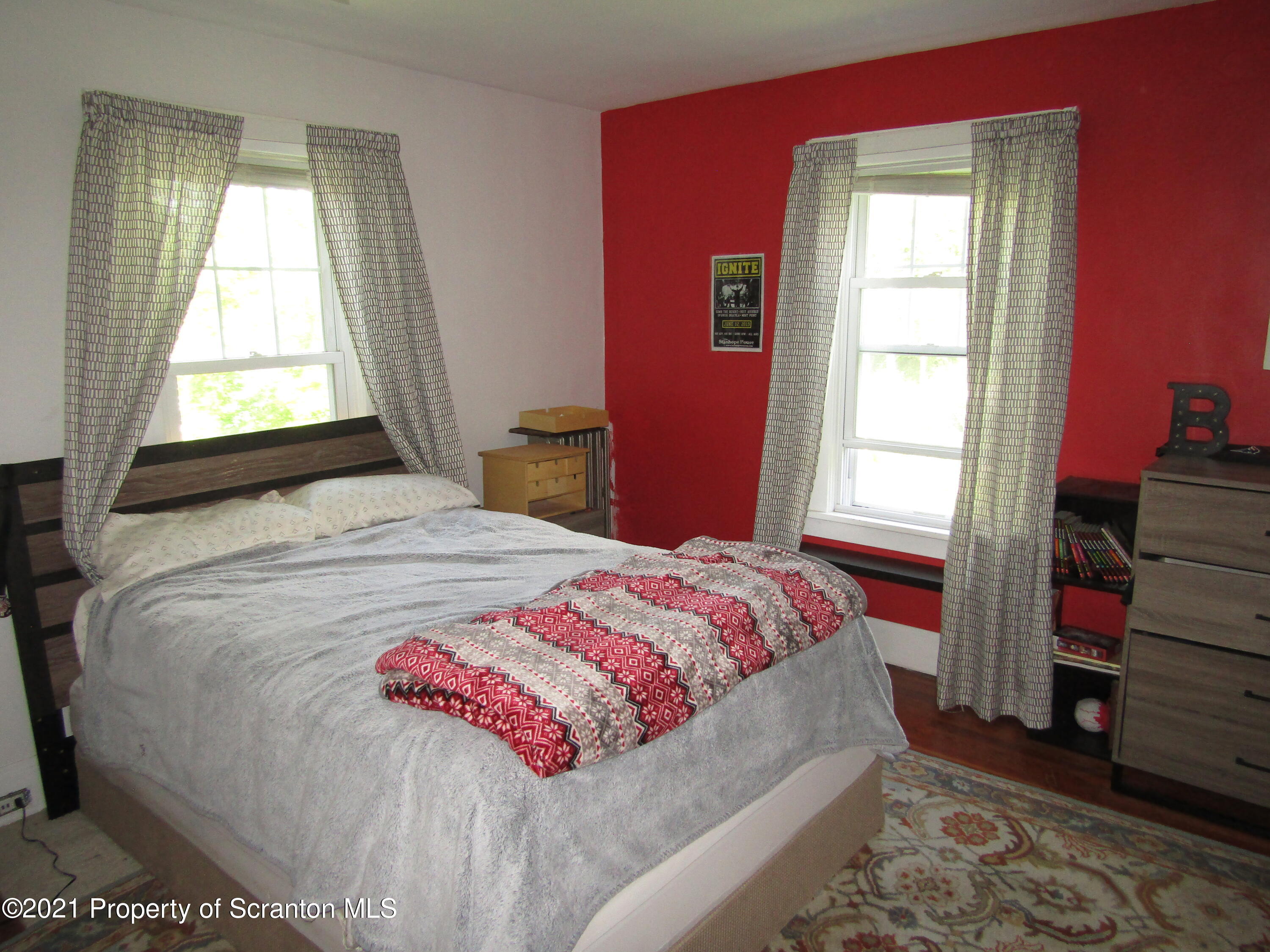 1314 State Rte 435 Moscow, PA 18444 - Photo 27 of 27 a bedroom with a bed and a window