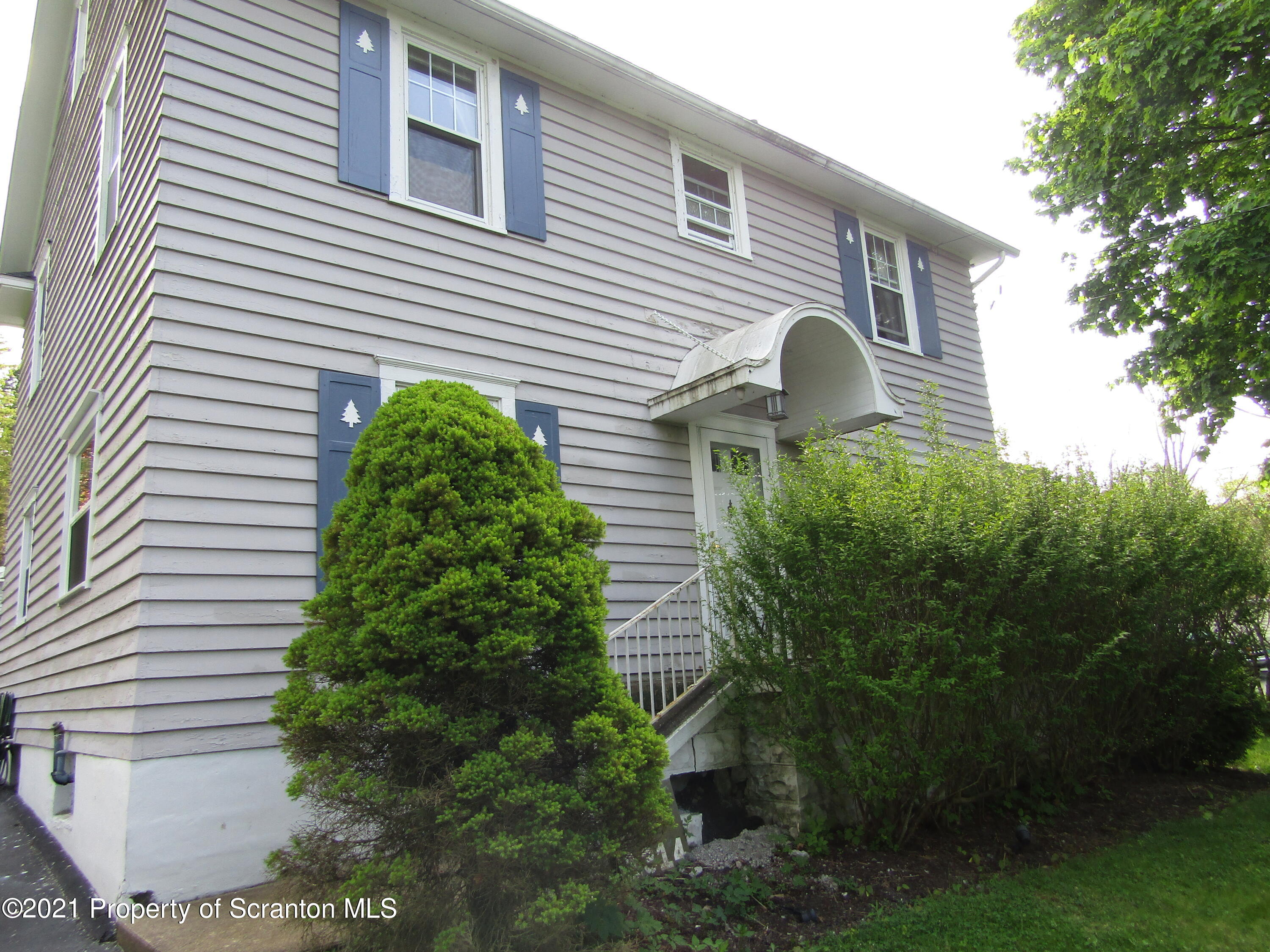 1314 State Rte 435 Moscow, PA 18444 - Photo 3 of 27 a view of a house with a yard and plants