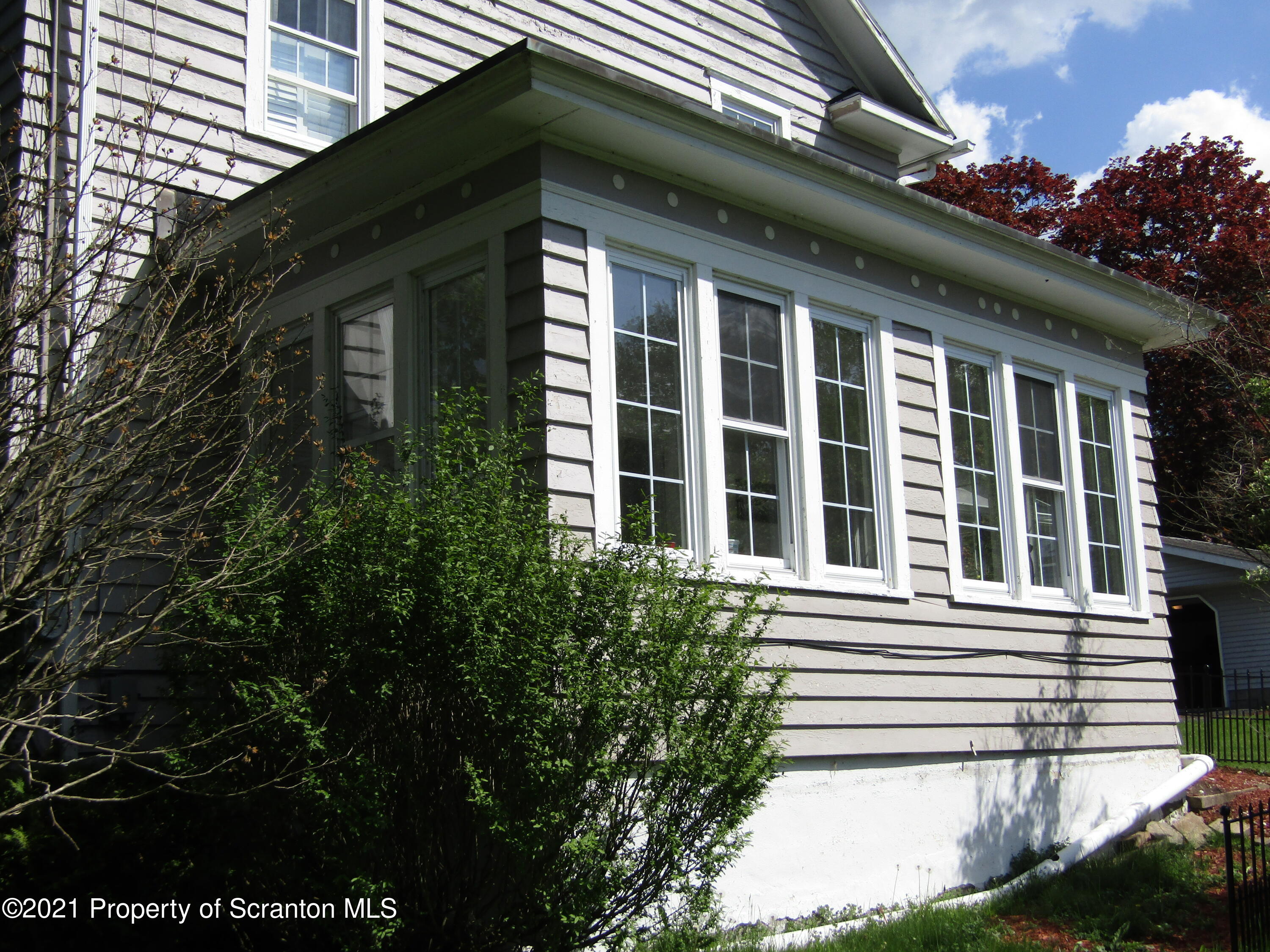 1314 State Rte 435 Moscow, PA 18444 - Photo 4 of 27 a front view of a house with a garden