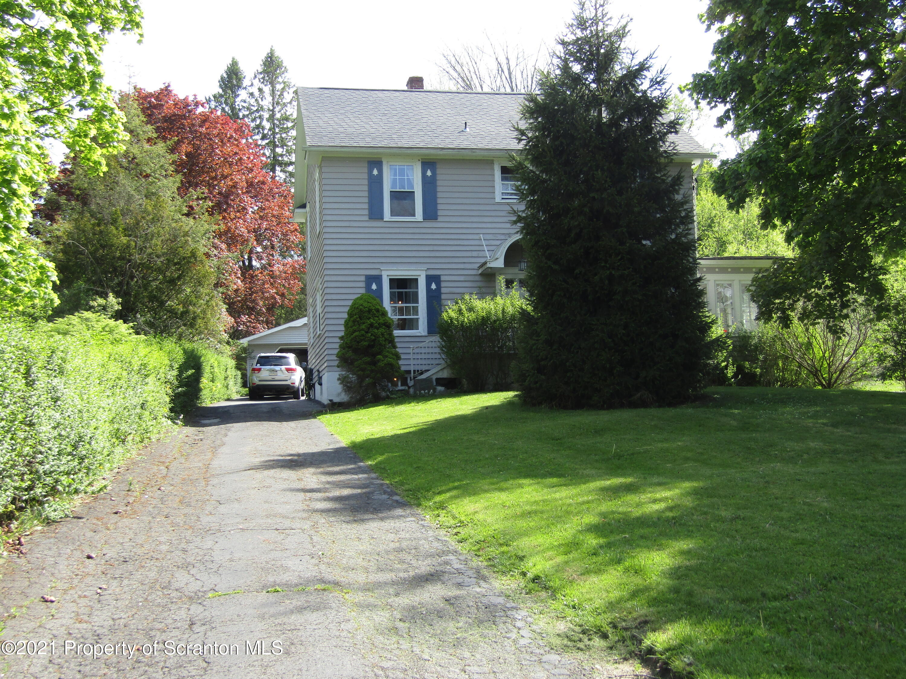 1314 State Rte 435 Moscow, PA 18444 - Photo 10 of 27 a front view of a house with garden