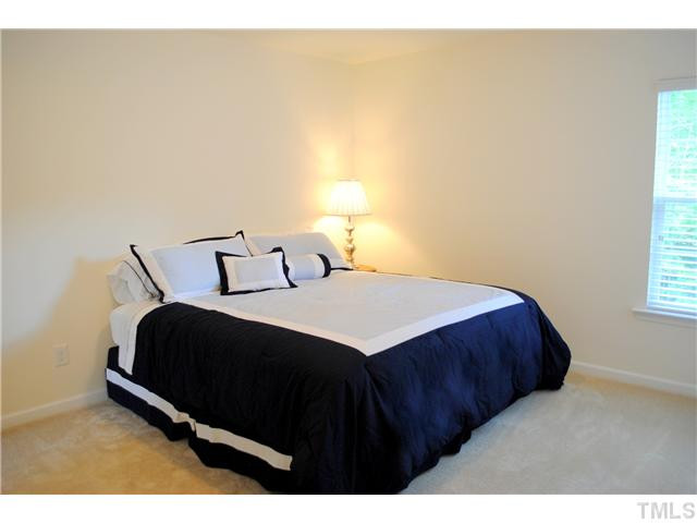 1018 Lakeview Road Durham, NC 27712 - Photo 16 of 25 a bedroom with a bed and a window