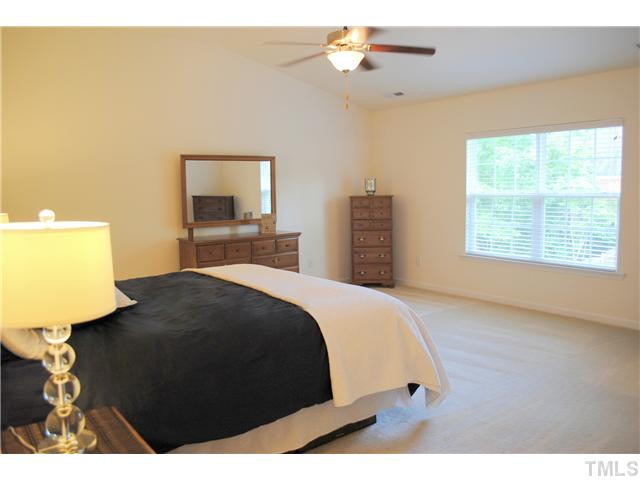 1018 Lakeview Road Durham, NC 27712 - Photo 17 of 25 a bedroom with a bed window and a night stand