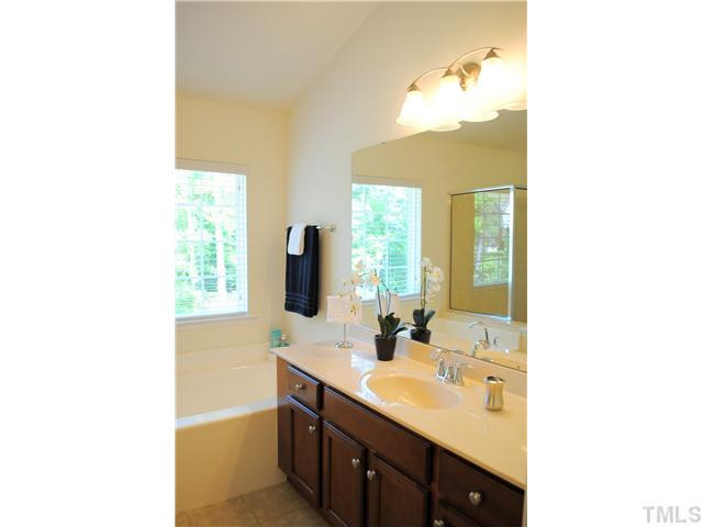 1018 Lakeview Road Durham, NC 27712 - Photo 19 of 25 a bathroom with a sink double vanity and a mirror