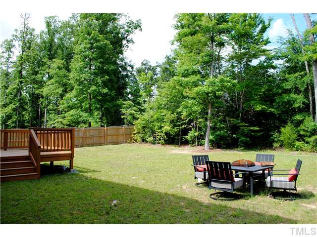 1018 Lakeview Road Durham, NC 27712 - Photo 23 of 25 a view of a wooden deck with chairs and a yard