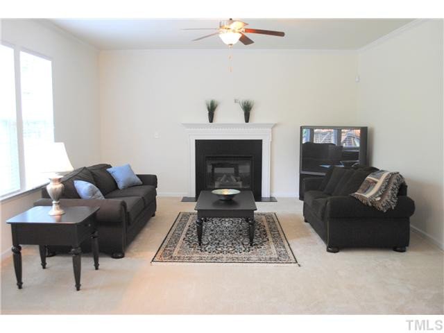 1018 Lakeview Road Durham, NC 27712 - Photo 3 of 25 a living room with furniture and a fireplace