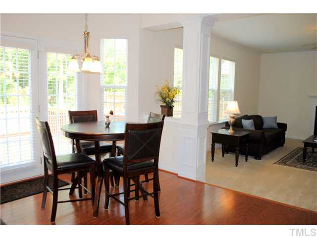 1018 Lakeview Road Durham, NC 27712 - Photo 6 of 25 a dining room with furniture and wooden floor