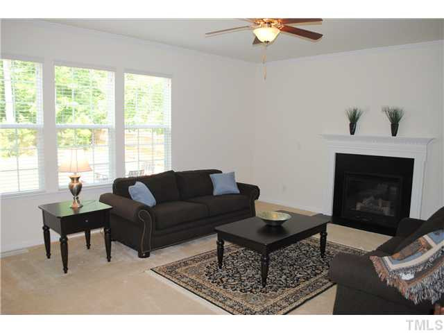 1018 Lakeview Road Durham, NC 27712 - Photo 7 of 25 a living room with furniture a fireplace and a flat screen tv