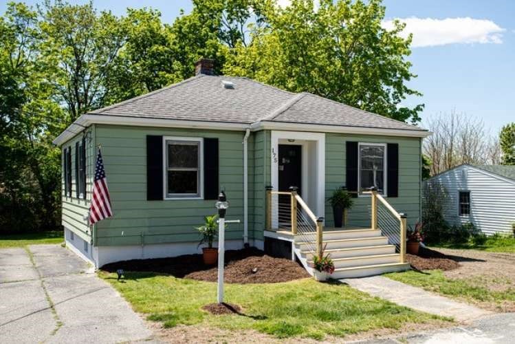 a front view of a house with garden