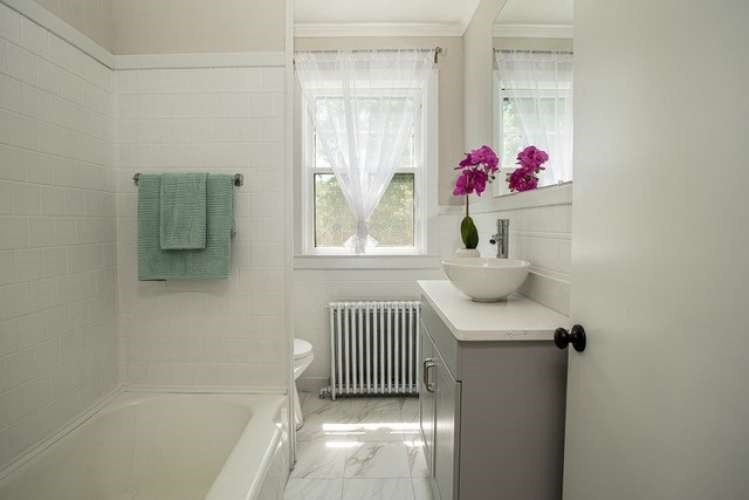 175 Maple Street Somerset, MA 02726 - Photo 12 of 25 a bathroom with a sink toilet and window