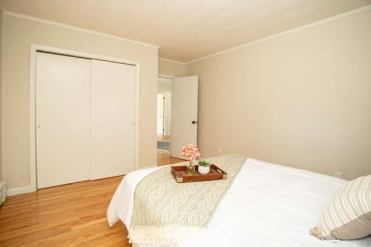 175 Maple Street Somerset, MA 02726 - Photo 15 of 25 a bedroom with a bed and a mirror