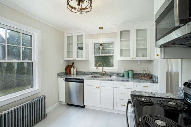 175 Maple Street Somerset, MA 02726 - Photo 5 of 25 a kitchen with stainless steel appliances a sink stove and cabinets