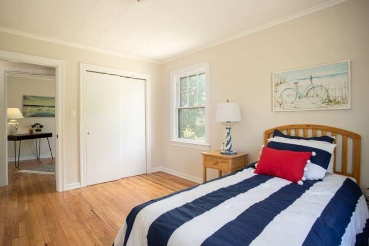 175 Maple Street Somerset, MA 02726 - Photo 9 of 25 a bedroom with a bed and a window