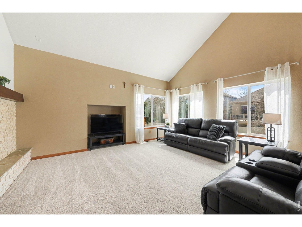 5507 Morgan Way Frederick, CO 80504 - Photo 11 of 45 a living room with furniture and a fireplace