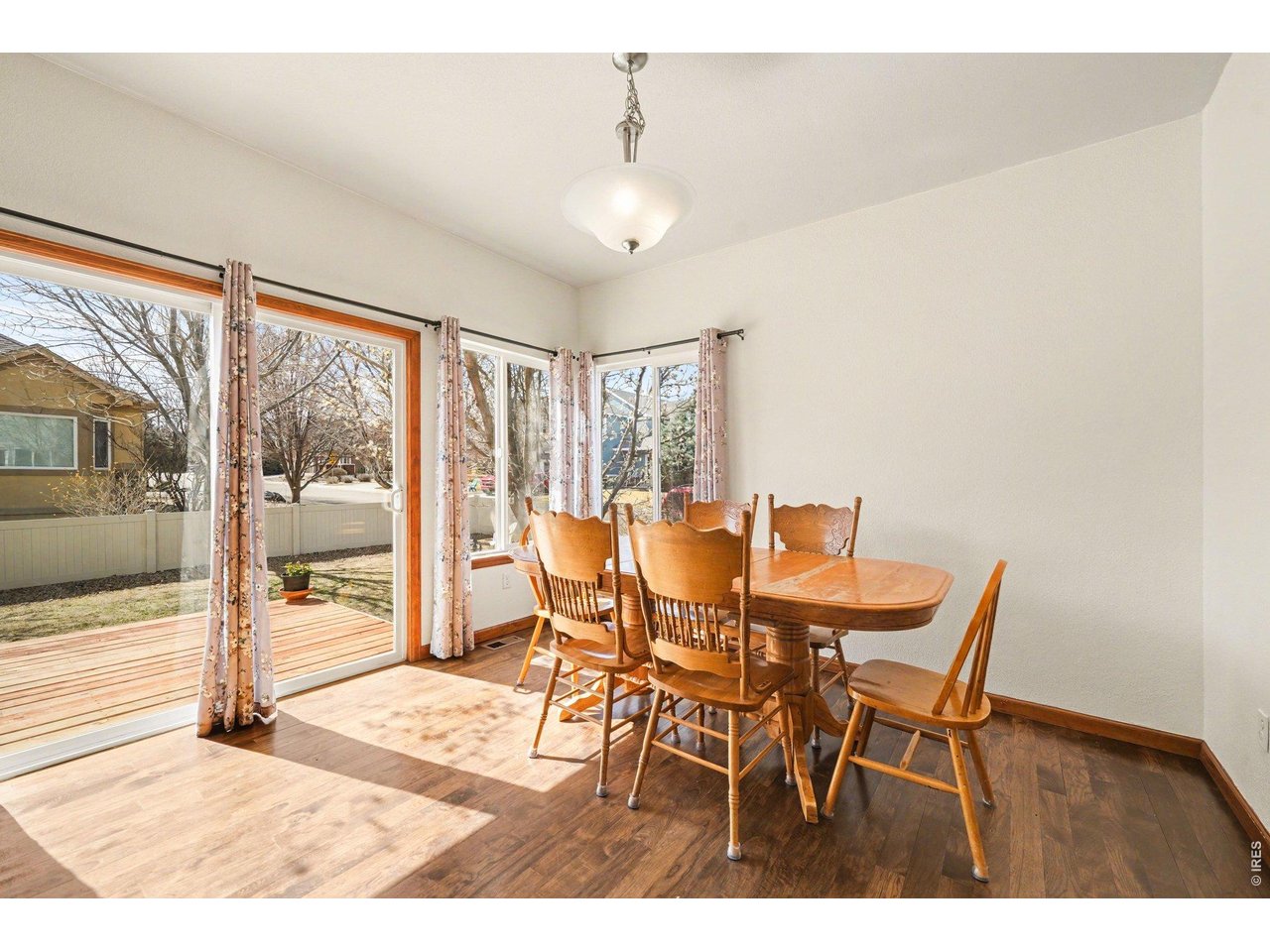 5507 Morgan Way Frederick, CO 80504 - Photo 20 of 45 a dining room with furniture and window