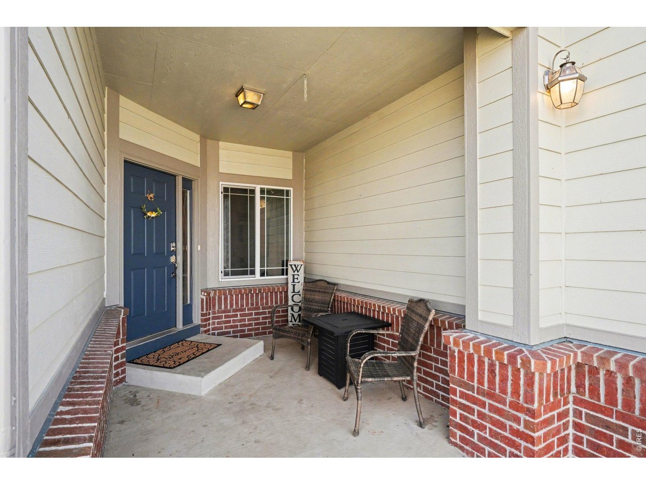5507 Morgan Way Frederick, CO 80504 - Photo 2 of 45 a balcony with a bench and chair