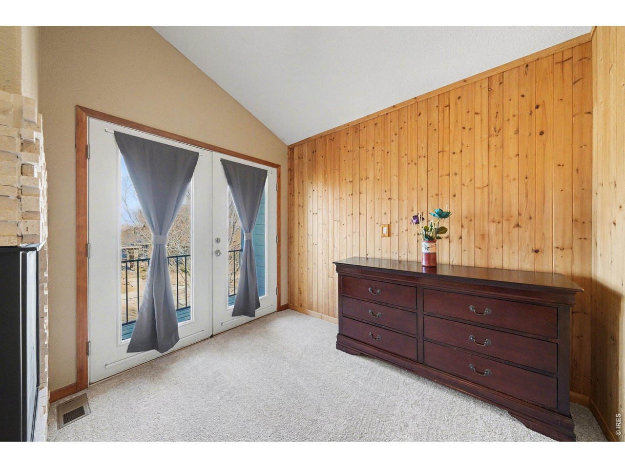 5507 Morgan Way Frederick, CO 80504 - Photo 27 of 45 a view of room with furniture and wooden floor