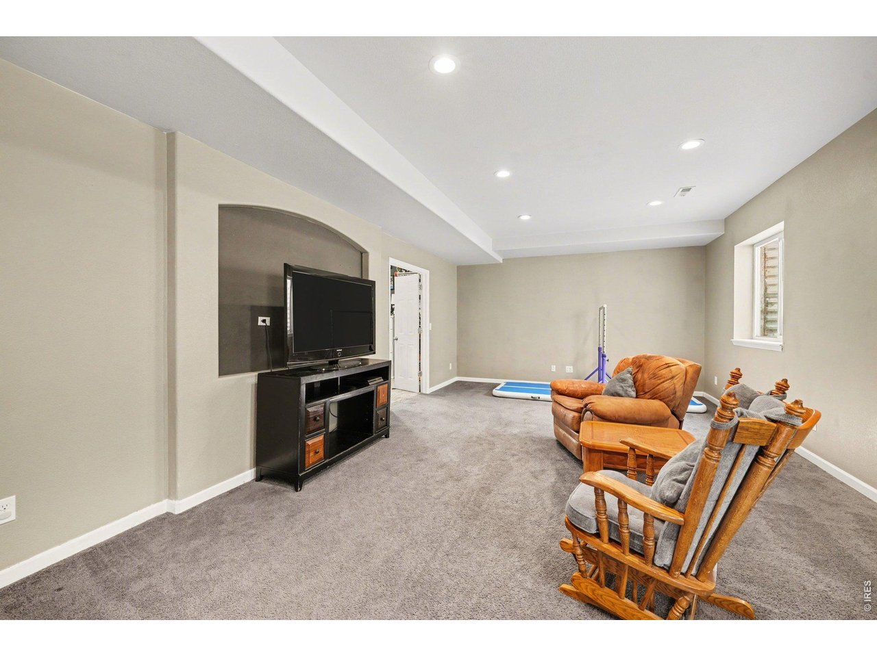 5507 Morgan Way Frederick, CO 80504 - Photo 35 of 45 a living room with furniture and a flat screen tv