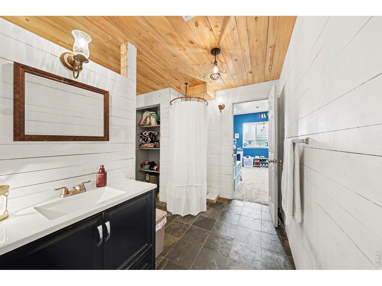 5507 Morgan Way Frederick, CO 80504 - Photo 40 of 45 a kitchen with a refrigerator and a sink