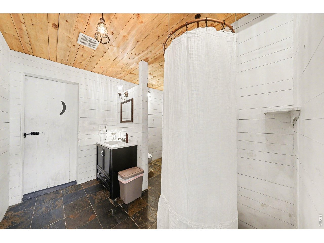 5507 Morgan Way Frederick, CO 80504 - Photo 41 of 45 a bathroom with a sink a toilet and shower