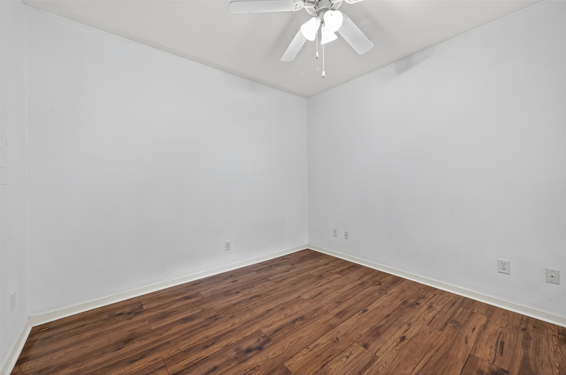 4041 Drake Street, Unit 203 Houston, TX 77005 - Photo 20 of 26 wooden floor in an empty room