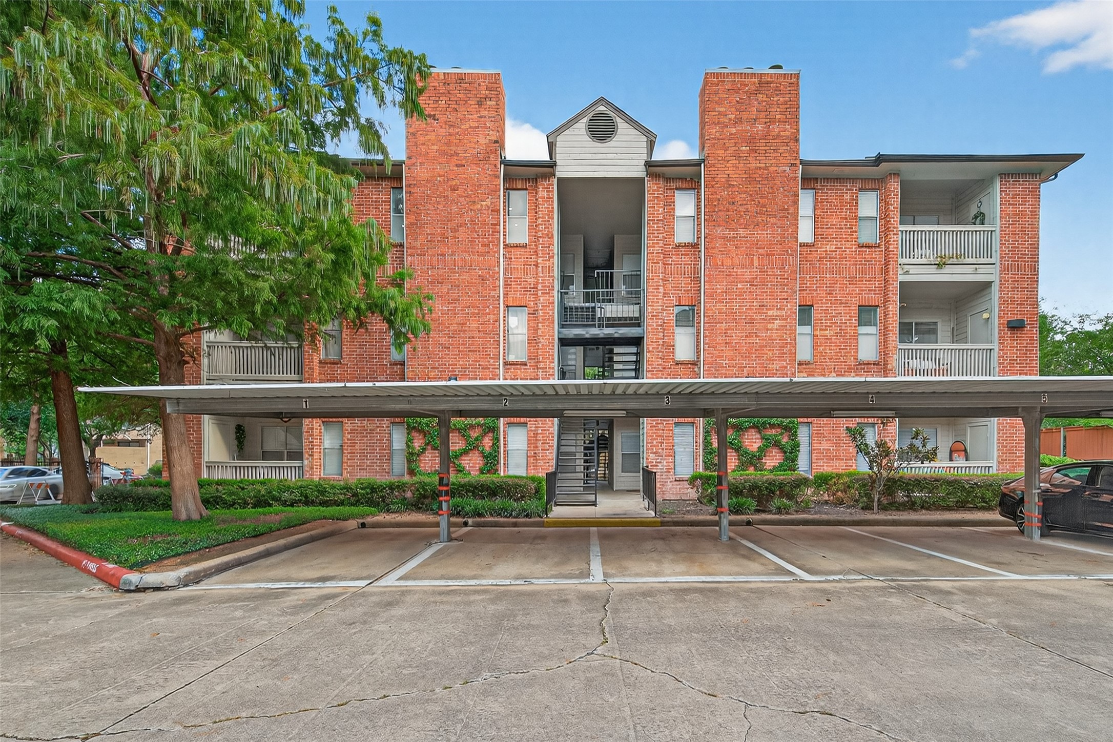 4041 Drake Street, Unit 203 Houston, TX 77005 - Photo 23 of 26 a view of building with yard