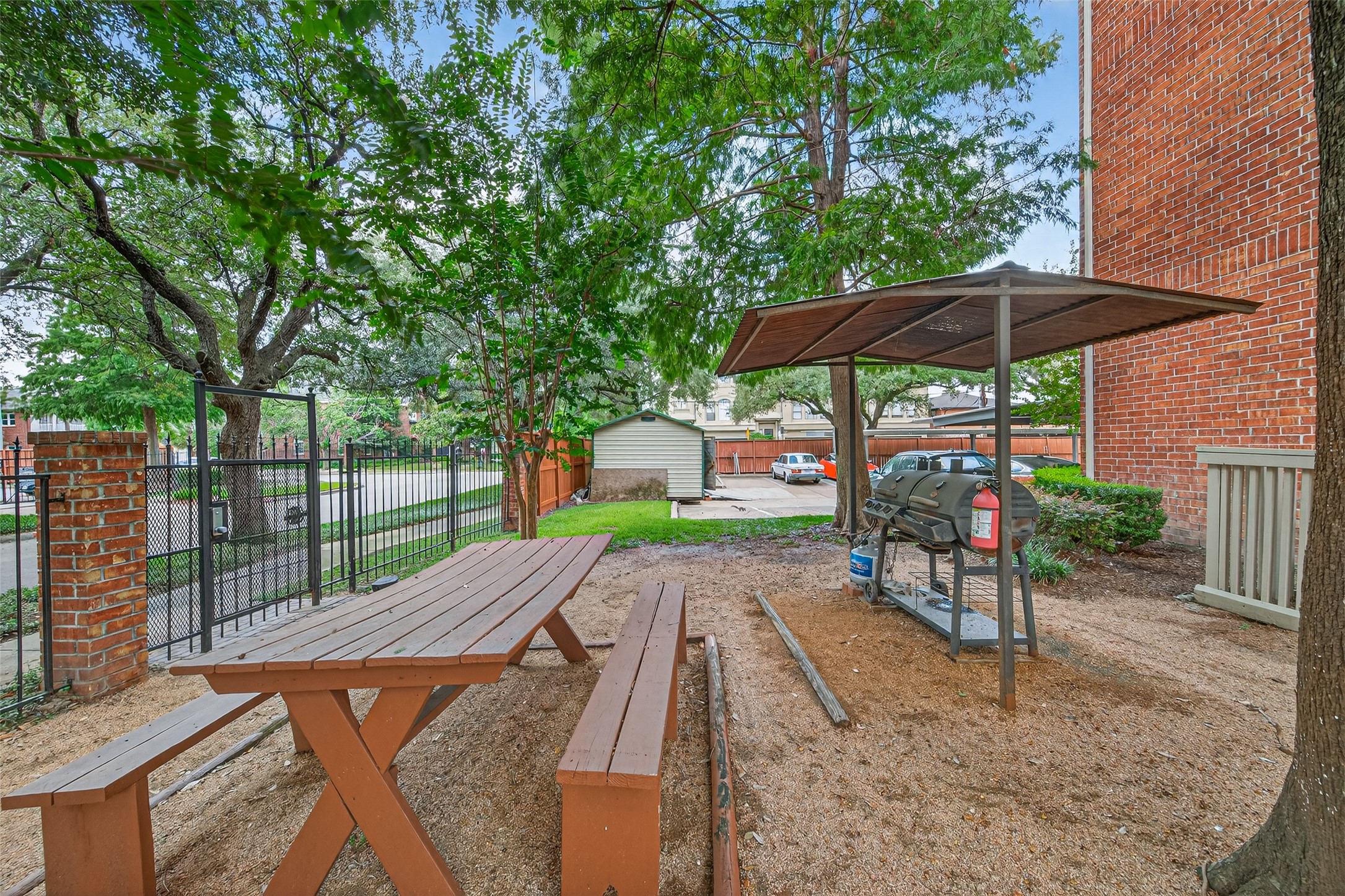 4041 Drake Street, Unit 203 Houston, TX 77005 - Photo 25 of 26 an outdoor space with patio and white umbrellas