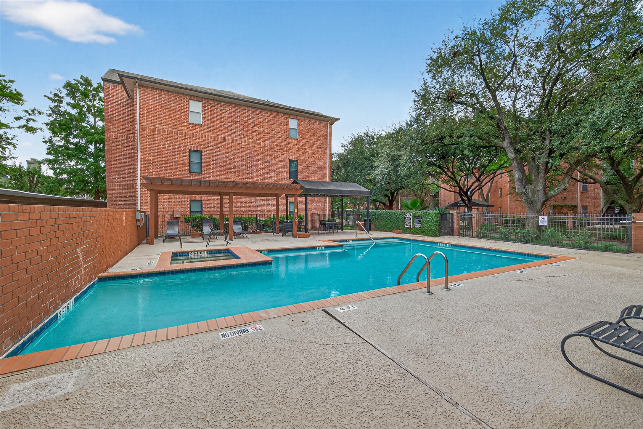 4041 Drake Street, Unit 203 Houston, TX 77005 - Photo 26 of 26 a view of a house with swimming pool and sitting area