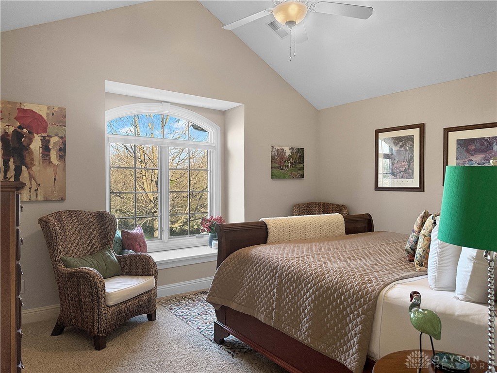 4096 Middle Urbana Road Urbana, OH 43078 - Photo 6 of 96 This cozy bedroom offers comfort and a tranquil view through its distinctive arched window.