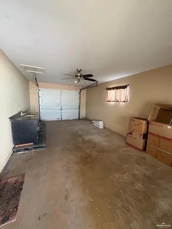 a view of a livingroom with furniture and staircase