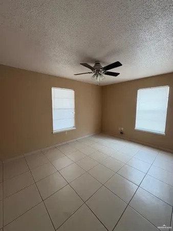 a view of an empty room and a window