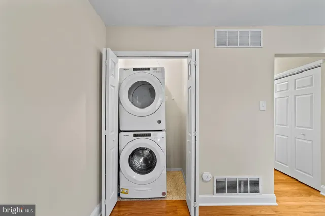 a view of a storage & utility room with dryer and washer