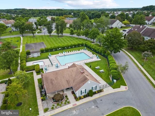 an aerial view of a house with a garden
