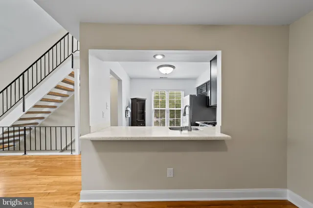 a view of an entryway with wooden floor