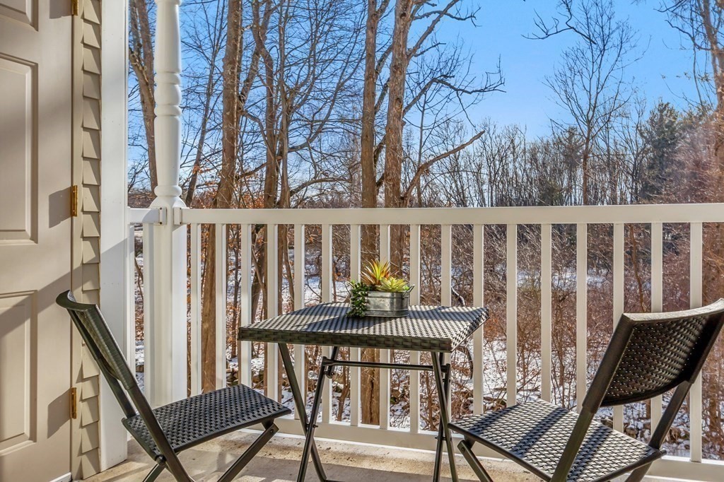 190 Chickering Road, Unit 208D North Andover, MA 01845 - Photo 14 of 42 a view of a balcony with chairs