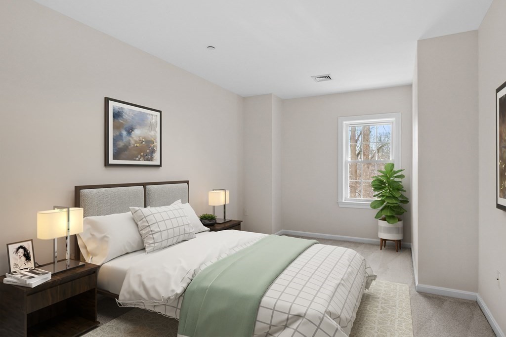 190 Chickering Road, Unit 208D North Andover, MA 01845 - Photo 15 of 42 a bedroom with a balcony a bed and a painting on the wall