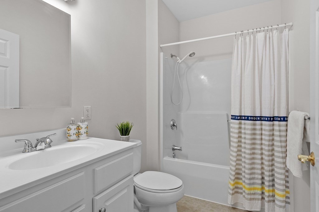 190 Chickering Road, Unit 208D North Andover, MA 01845 - Photo 20 of 42 a bathroom with a sink a toilet and shower