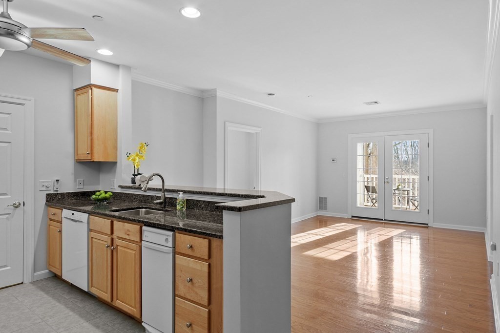 190 Chickering Road, Unit 208D North Andover, MA 01845 - Photo 2 of 42 a kitchen with stainless steel appliances granite countertop a stove and a sink